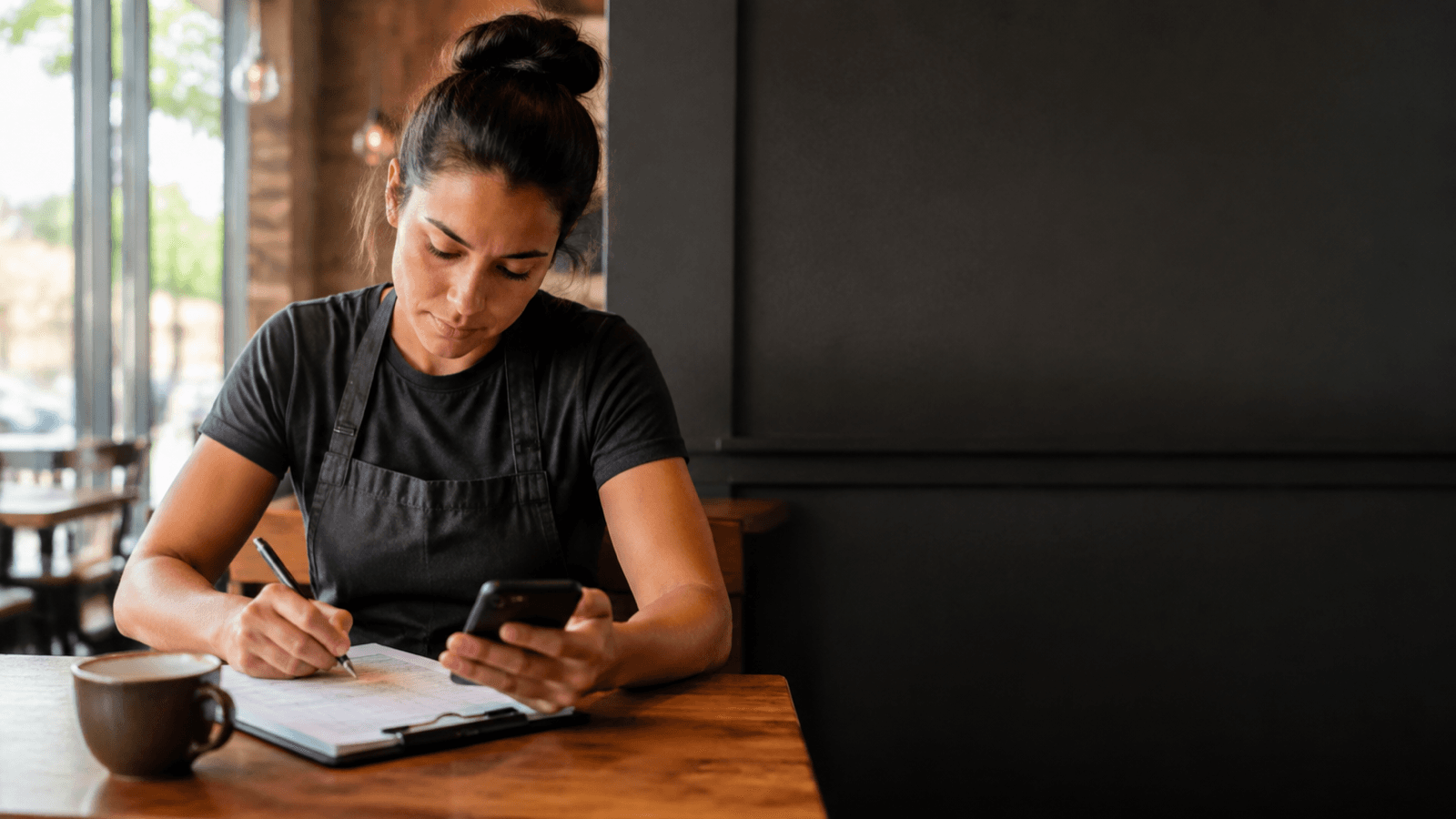 An hourly worker checking a shift calculation on a phone.